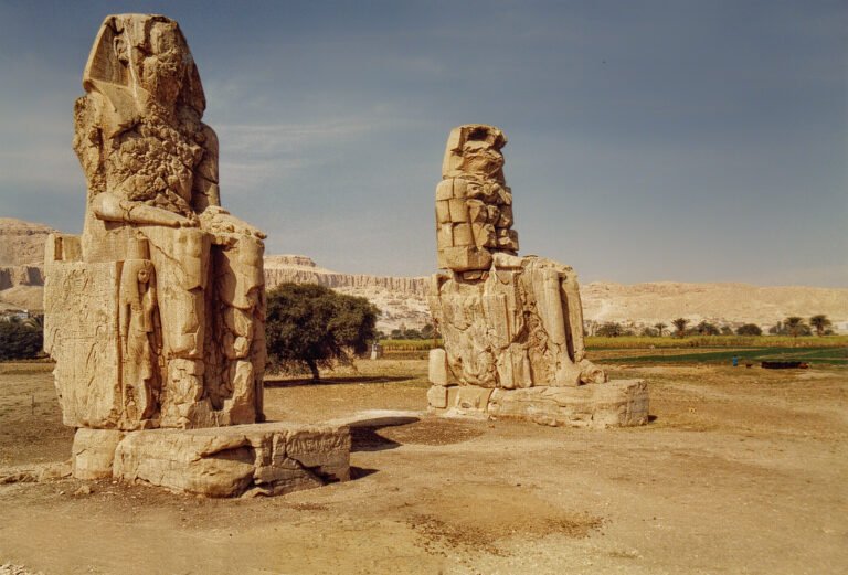 Two seated Colossi of Memnon statues on the West Bank of Luxor