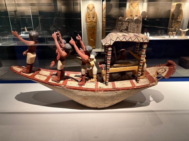 Painted funerary boat model displayed at the Mummification Museum in Luxor