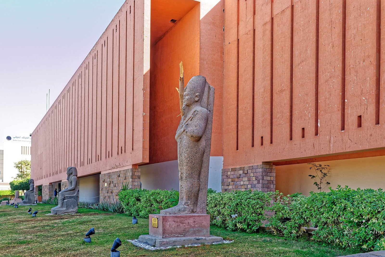 Exterior of Luxor Museum with ancient Egyptian statues in the garden