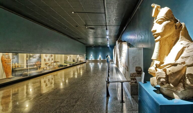Interior gallery at Luxor Museum with sculptures and display cases