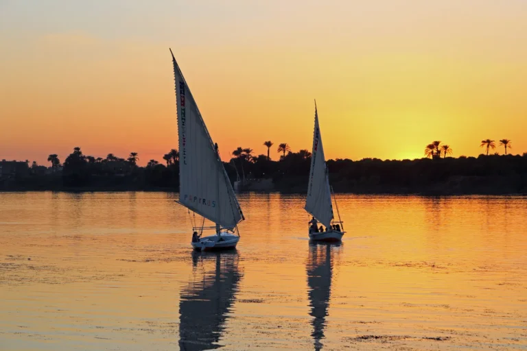 Felucca sailboats on the Nile at sunset
