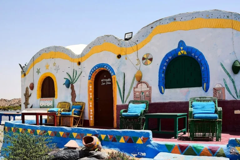 Terrace of a painted Nubian house with seating in a village near Aswan