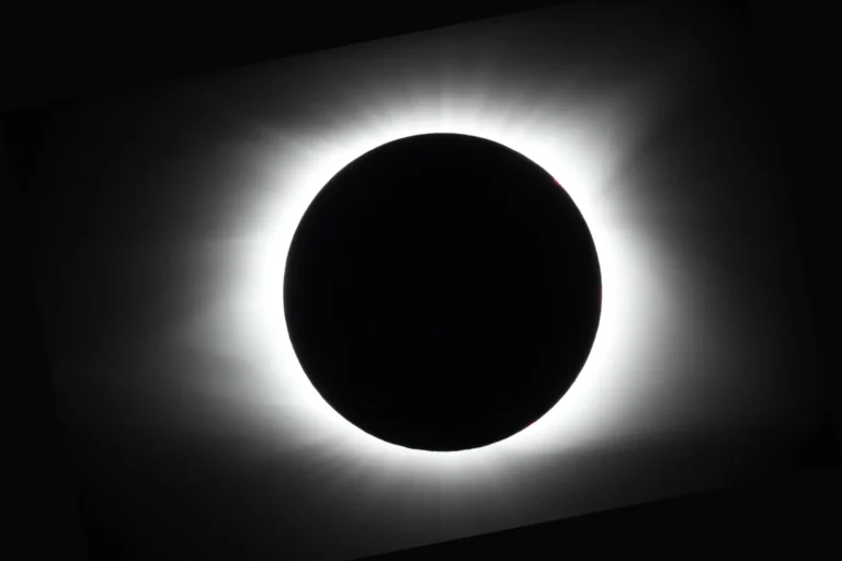 Bright white corona streaming from the eclipsed Sun during totality